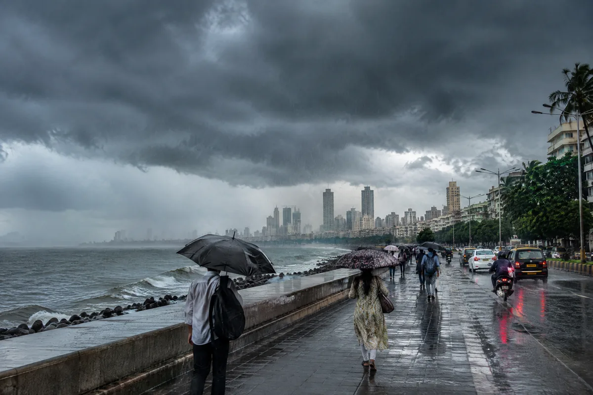 Monsoon clouds and rain moving across an Indian city