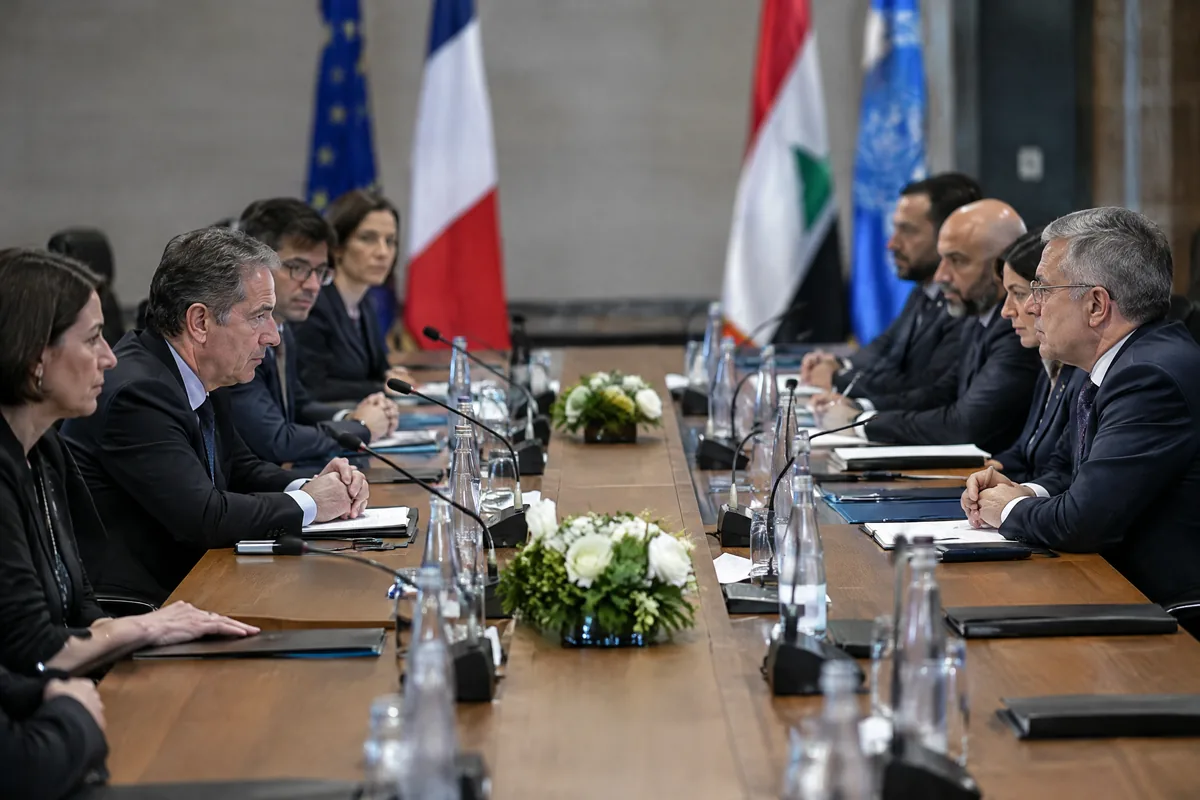 Diplomats meeting across a conference table